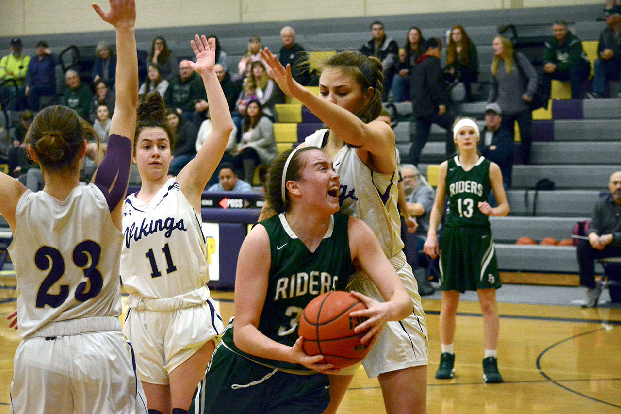 Port Angeles Jaida Wood (33) goes up for a layup against North Kitsaps Erin Pearson (20) during the Riders 54-48 win over the Vikings on Jan. 31. Mark Krulish/Kitsap News Group