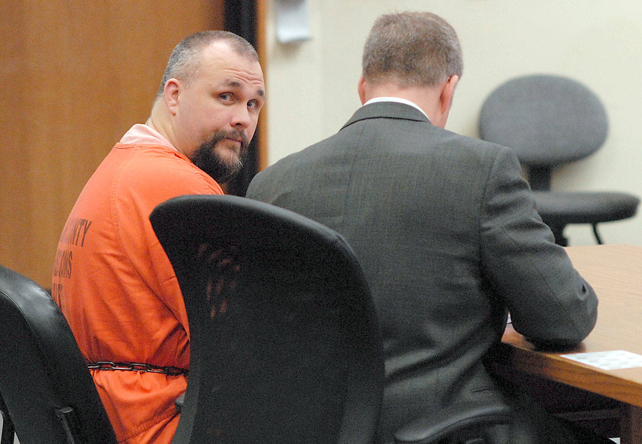 James Edward Sweet, left, sits with attorney Alex Stalker on Tuesday in Clallam County Superior Court in Port Angeles before pleading guilty to multiple counts of assault with a deadly weapon in connection with a May 2016 gun battle with law enforcement officers on U.S. Highway 101 east of Port Angeles. (Keith Thorpe/Peninsula Daily News)