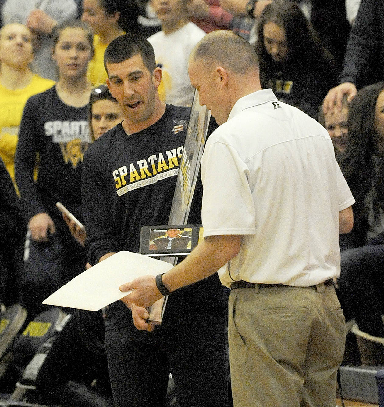 &lt;strong&gt;Lonnie Archibald&lt;/strong&gt;/for Peninsula Daily News                                Kasey Ulin, Forks player from 1996 to 2000 and now the head coach at Port Angeles High School, accepts his plaque as a member of the Forks athletics Hall of Fame on Friday.