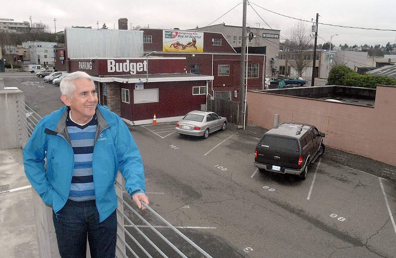 Michael Peters, enterprise executive officer for the Lower Elwha Klallam Tribe, looks over a portion of downtown Port Angeles where the tribe plans on building a new hotel. (Keith Thorpe/Peninsula Daily News)