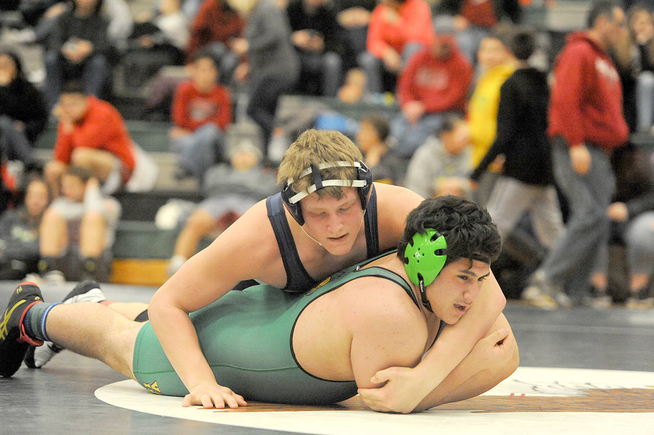 Lonnie Archibald/for Peninsula Daily News Forks’ Luke Dahlgren, top, is a strong contender for the 220-pound wrestling title at Mat Classic XXIX, the state wrestling tournament, this weekend at the Tacoma Dome.