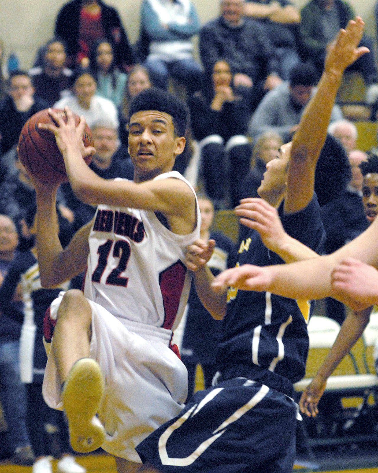 Neah Bay’s Sean Bitegeko, right, tries to shoot past Tacoma Baptist’s Kyongjin So in second quarter play on Tuesday at Port Angeles High School.                                Keith Thorpe/Peninsula Daily News