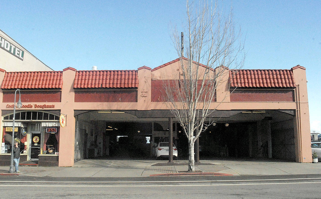 The building housing the service center for Dungeness Bus Lines and Budget and Avis rent-a-car agencies, as well as Cock-a-Doodle Doughnuts, will be razed to make way for a four-story waterfront hotel planned by the Lower Elwha Klallam Tribe in downtown Port Angeles. (Keith Thorpe/Peninsula Daily News)