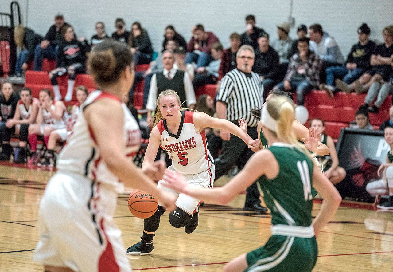 Port Townsendâs Kaitlyn Meek drives downcourt against Port Angeles Roughrider Gracie Long in a game played on Tuesday in Port Townsend. Steve Mullensky/for Peninsula Daily News