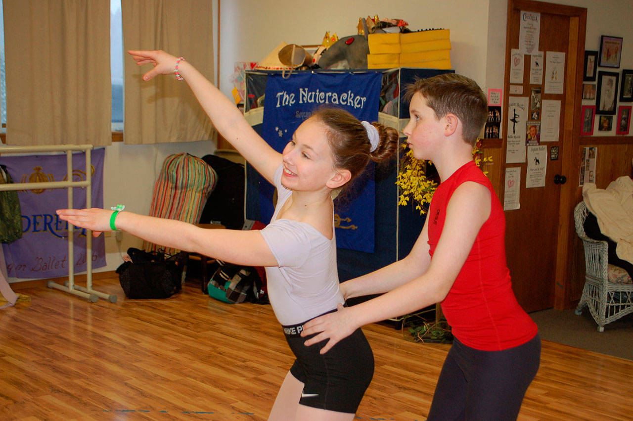 Mia Sayer, cast as Sleeping Beauty, and Brody Andersen, playing the role of Prince Charming, rehearse a dance number for the upcoming show “Sleeping Beauty” presented by Olympic Theatre Arts and Sequim Ballet. (Erin Hawkins/Olympic Peninsula News Group)