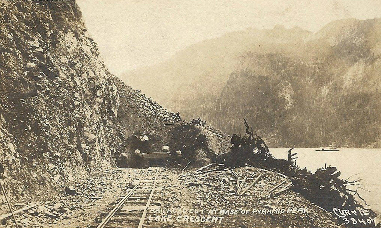 This postcard shows the original builders of the Spruce Railroad. A paddle wheel ferry boat can be seen on Lake Crescent. (Forks Forum Archives)