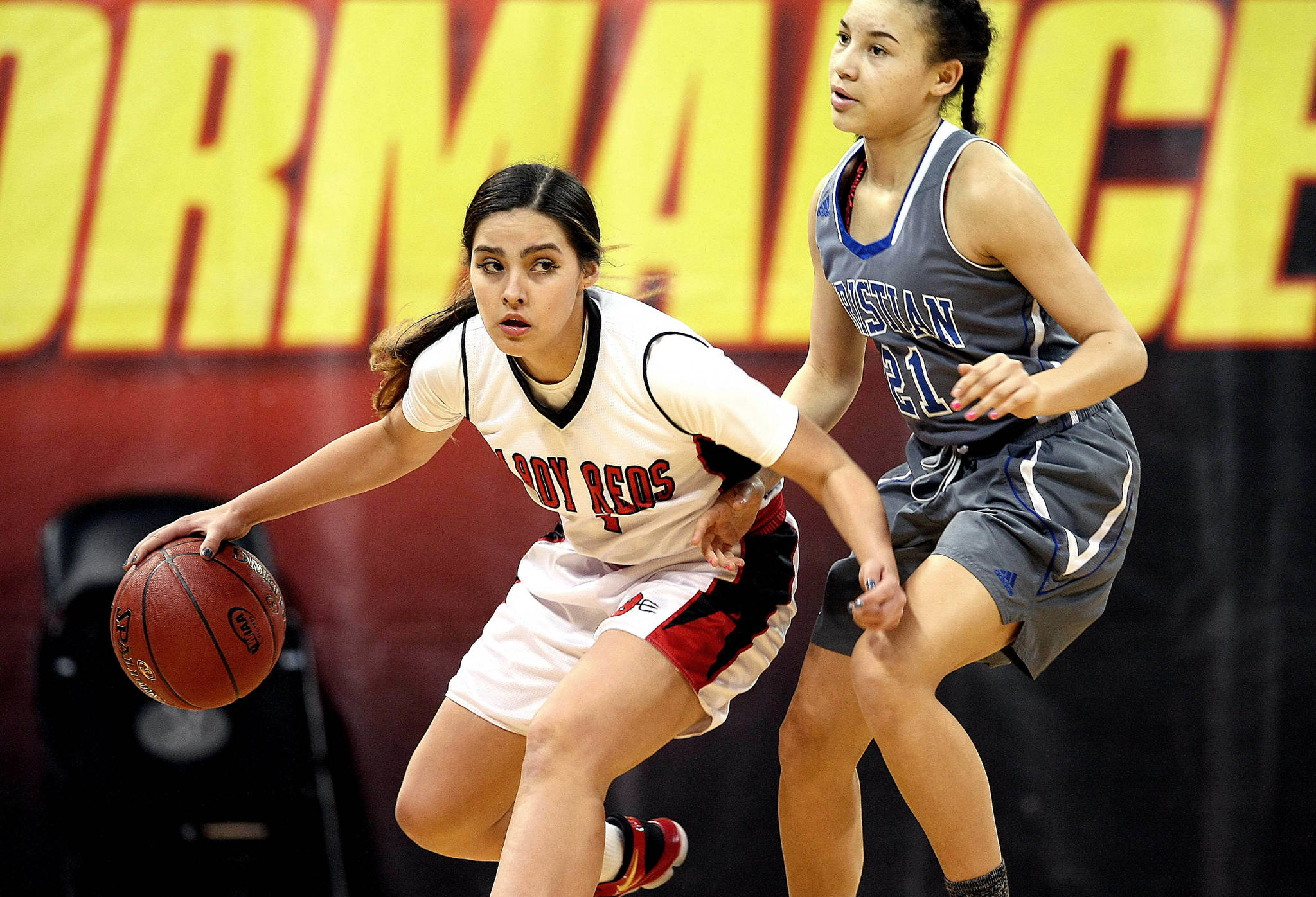 David Willoughby/for Peninsula Daily News Neah Bay’s Courtney Swan looks upcourt while defended by Mount Vernon Christian’s Jaiden Hill during the Red Devils’ 53-34 Class 1B state quarterfinal win over the Hurricanes at Spokane Arena on Thursday.