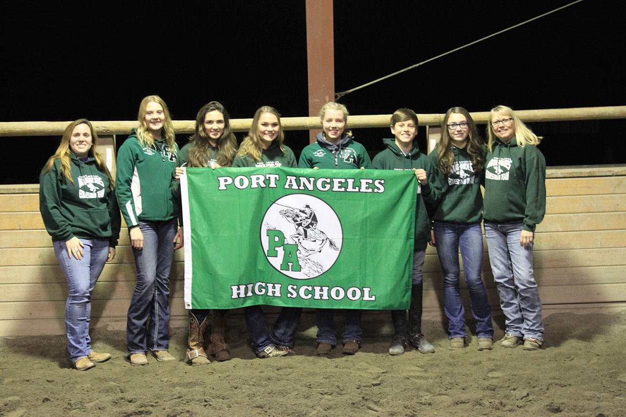 The Port Angeles High School 2018 equestrian team is, from left, assistant coach Liv Dietzman, Abby Hjelmeseth, Emma Albright, Emily Gear, Emily Menshew, Ben Robertson, Madison Carlson and coach Tina VanAusdle. (Dan Hjelmeseth)