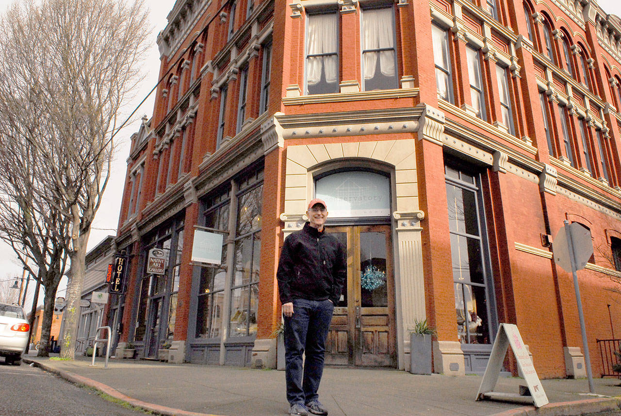 Bill Tennent, executive director of the Port Townsend Historical Society, stands before the N.D. Hill Building at 635 Water St. The building started life as a pharmaceutical warehouse but was best known as the site of the town tavern. It will be on Saturday’s historical walking tour. (Jeannie McMacken/ Peninsula Daily News)