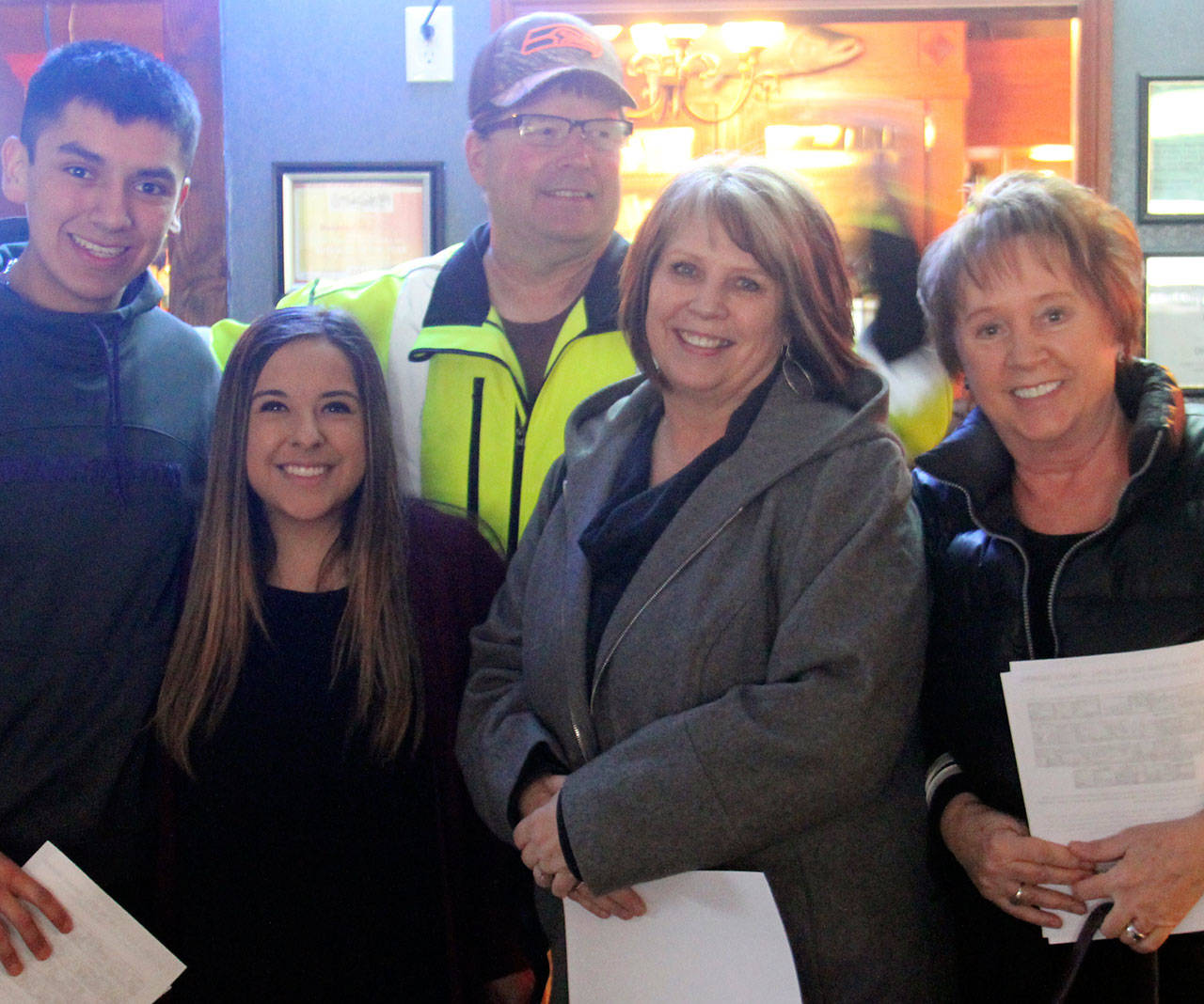 Quillayute Valley Scholarship Auction student organizers, from left, Marshal Grant and Taegan Counsell, are pictured with auction board members, also from left, Jerry Leppell, JoMarie Miller and Cheri Dahlgren. (Christi Baron/Olympic Peninsula News Group)