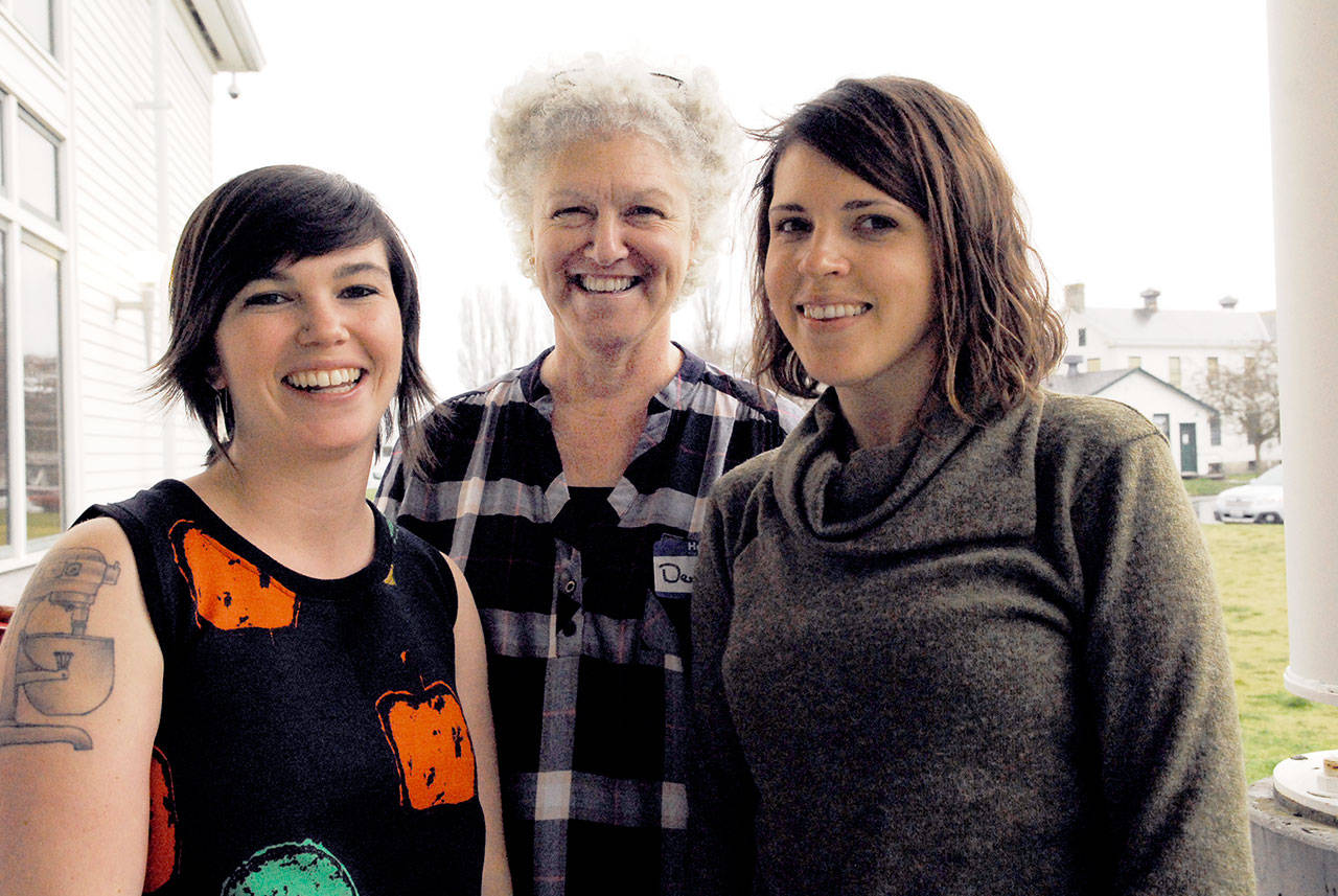 Rethinking Rural co-founders Madeline Moore of Chinook, left, and Mallory Weinheimer of Port Townsend invited 50 millennials to Fort Worden to discuss the future of rural living and success for their demographic. Denise Pranger, center, a flower farmer from Port Townsend, is a non-millennial mentor to the group. (Jeannie McMacken/ Peninsula Daily News)