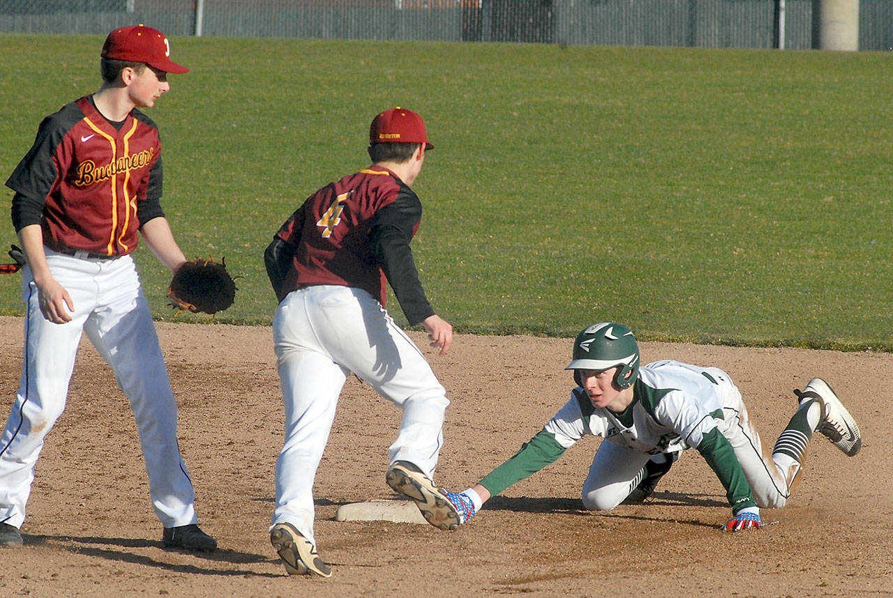 Port Angeles’ Hayden Woods, right, reaches for the bag after successfully stealing second, beating the throw to Kingston second baseman Leif Whalen, center, as shortstop Ethan Sax looks on during the third inning on Thursday at Port Angeles Civic Field. (Keith Thorpe/Peninsula Daily News)