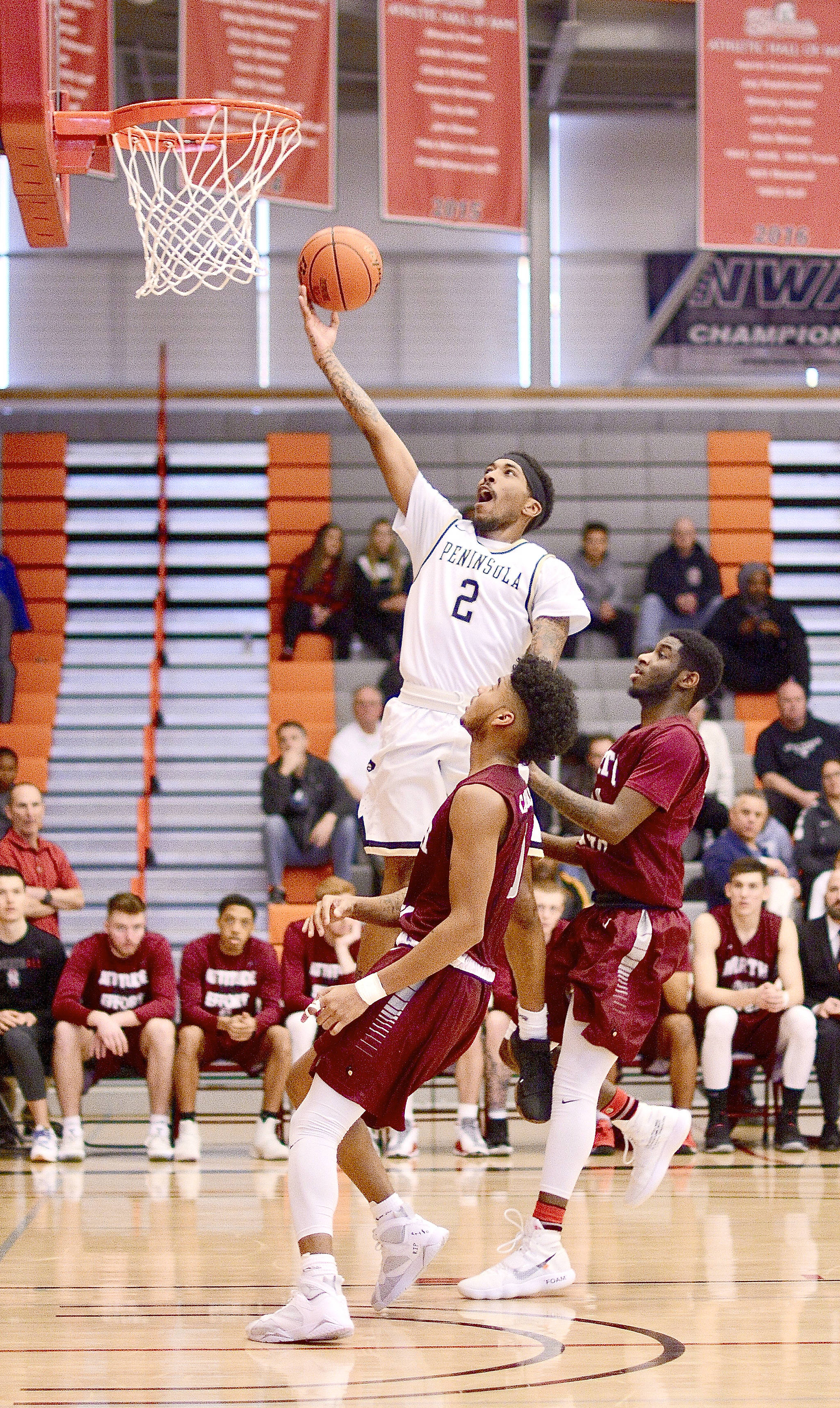 <strong>Jay Cline/</strong>for Peninsula Daily News Peninsula College’s Cameron Burton goes up for a layup against North Idaho in the NWAC Championship game Sunday in Everett.
