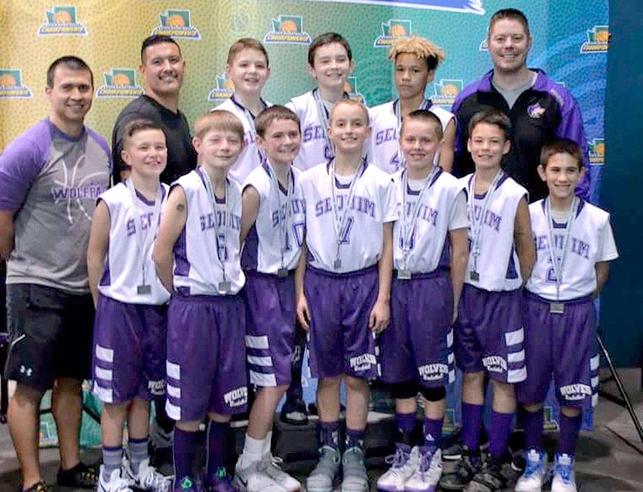 The Sequim fifth-grade select basketball team that finished second at the Washington state tournament and finished the season 21-3. From left, back, are assistant coaches Dennis Laboy and Shane Alonzo, Charlie Grider, Jamison Gray, Lincoln Liggins and head coach John Marshall.From left, front, are Izaiah Alonzo, Ethan Melnick, Hayden Kiesser, Easton Munger, Blake Marshall, Andrew Brown and Bryant Laboy.