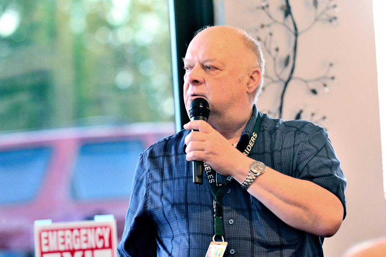 Former state Rep. Jim Buck shares his experience from Puerto Rico, comparing the response to the hurricane that struck the small U.S. territory to what would happen if a massive earthquake hit Clallam and Jefferson counties, while addressing the Port Angeles Business Association on Tuesday. (Jesse Major/Peninsula Daily News)