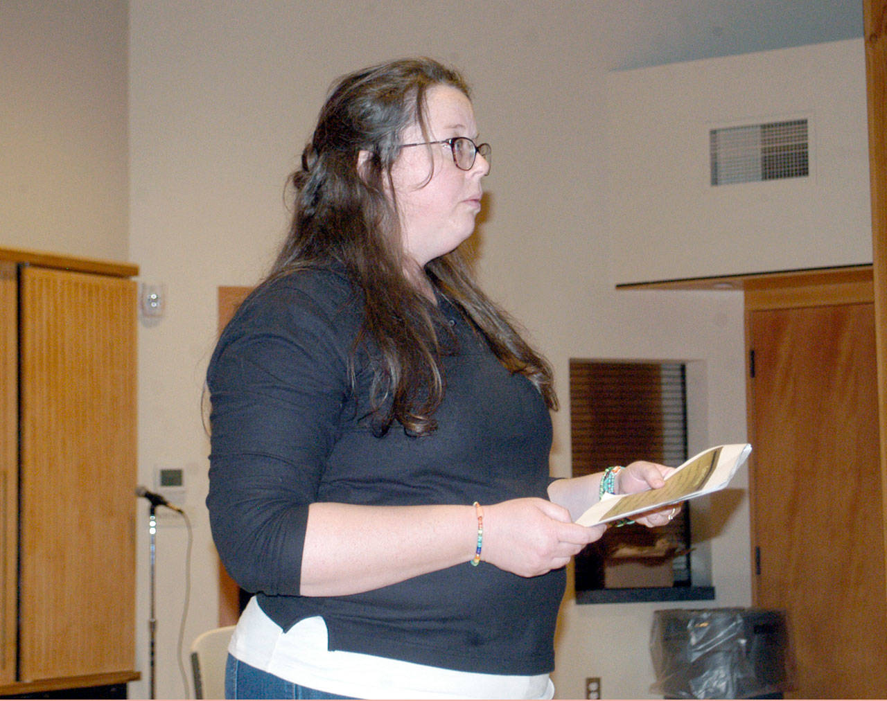 Olympic National Park spokeswoman Penny Wagner updates Forks-area residents on the ongoing construction of U.S. highway 101 around Lake Crescent. (Rob Ollikainen/Peninsula Daily News)