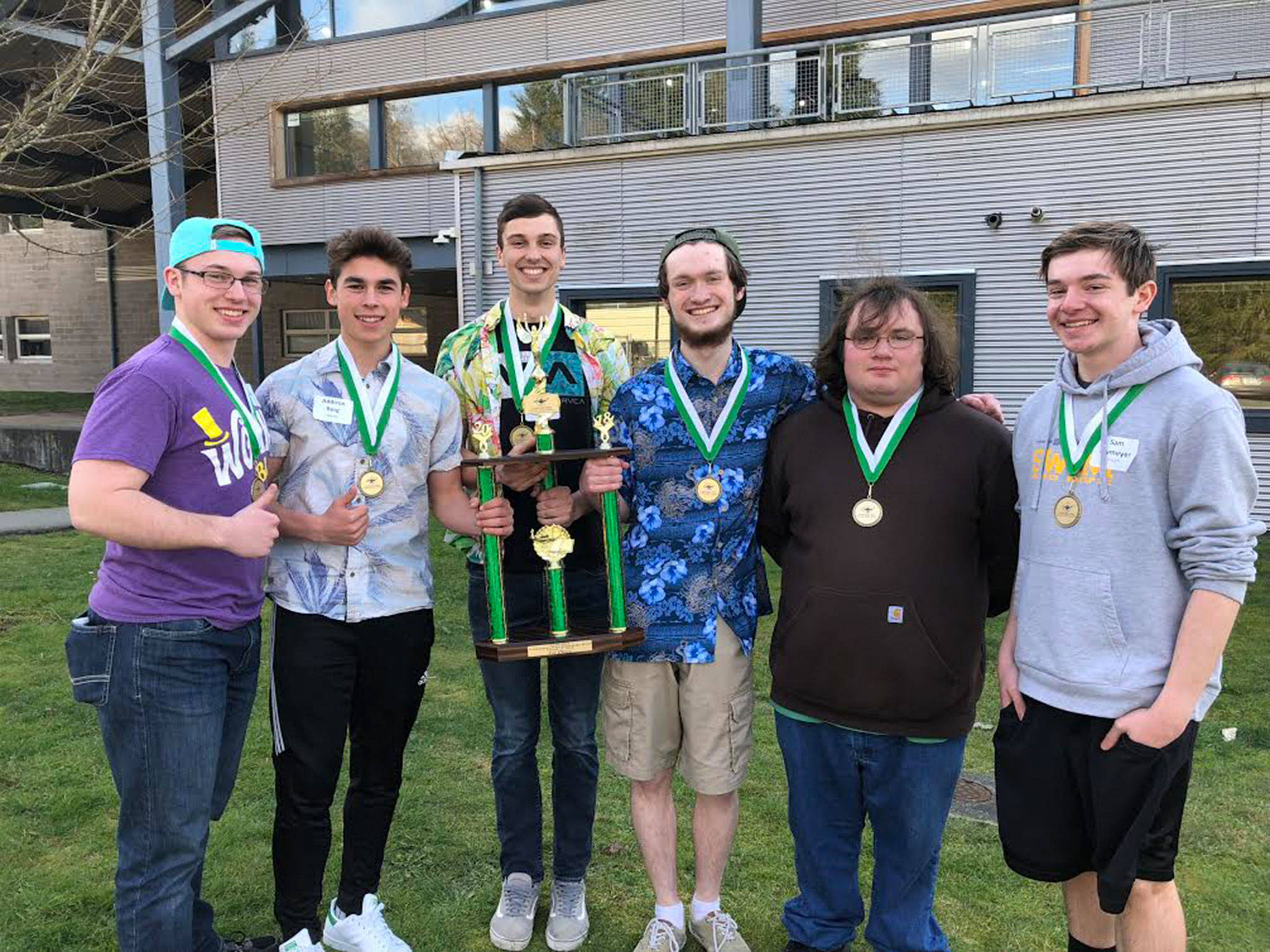Sequim High School seniors Joe Benjamin, left, Addison Berg, Liam Stevenson, Devin Hibler, John Purvis and sophomore Sam Frymyer celebrate their win as Knowledge Bowl State Championships on March 17 at Arlington High School.