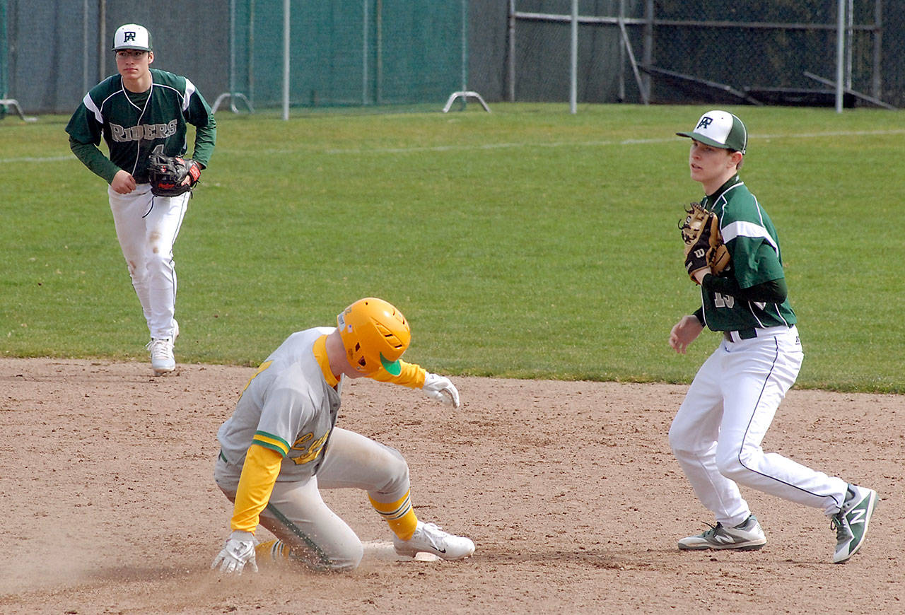 Keith Thorpe/Peninsula Daily News Lynden’s Jack Doolittle arrives late at second after being forced out by Port Angeles second baseman Milo Whitman, right, as shortstop Gavin Guerrero looks on in the fifth inning on Saturday at Port Angeles Civic Field.