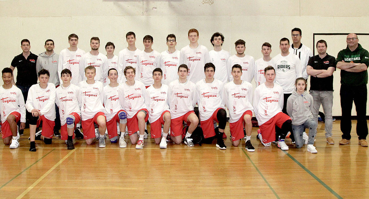 About 25 kids on eighth-grade and U-18 squads from Luxembourg played in the Port Angeles Parks and Rec April Fool’sDay Tournament this weekend. Port Angeles High School coach Kasey Ulin (fourth from right, middle row), who playedprofessionally in Luxembourg, and his wife Bracey coached these kids in Luxembourg and helped make arrangements tobring them to Port Angeles to play. (Dave Logan /for Peninsula Daily News)