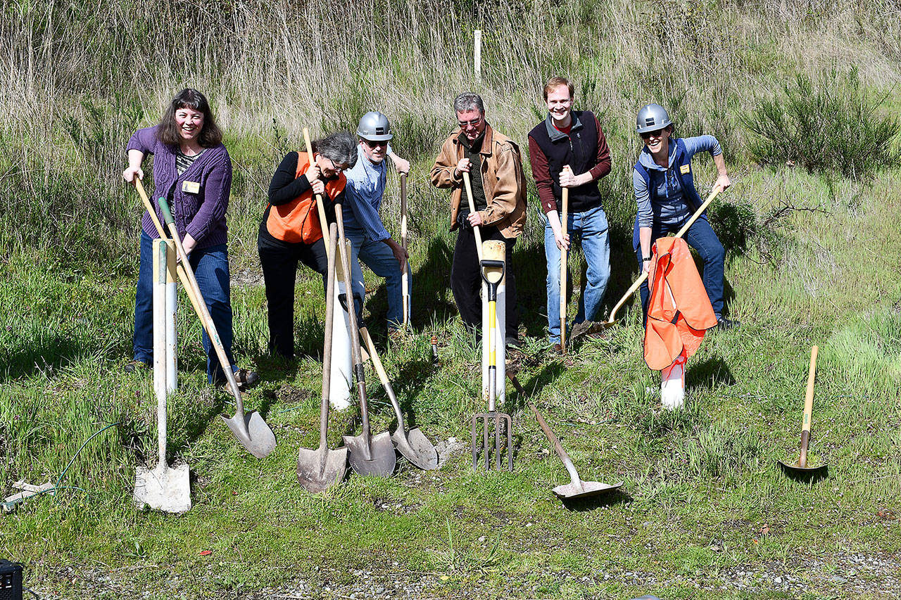 Members of The Food Co-op board take part in a ceremonial groundbreaking Tuesday to signal the expansion of its building on Kearney Street. The construction project will add 2,900 square feet to the building’s footprint allowing a wider selection of produce and natural products to be offered. From left are President Monica LaRoux, Secretary Lisa Barclay, Vice President Owen Rowe, Board member David Johnson, Board member Dylan Carter and General Manager Kenna Eaton. (Jeannie McMacken/Peninsula Daily News)