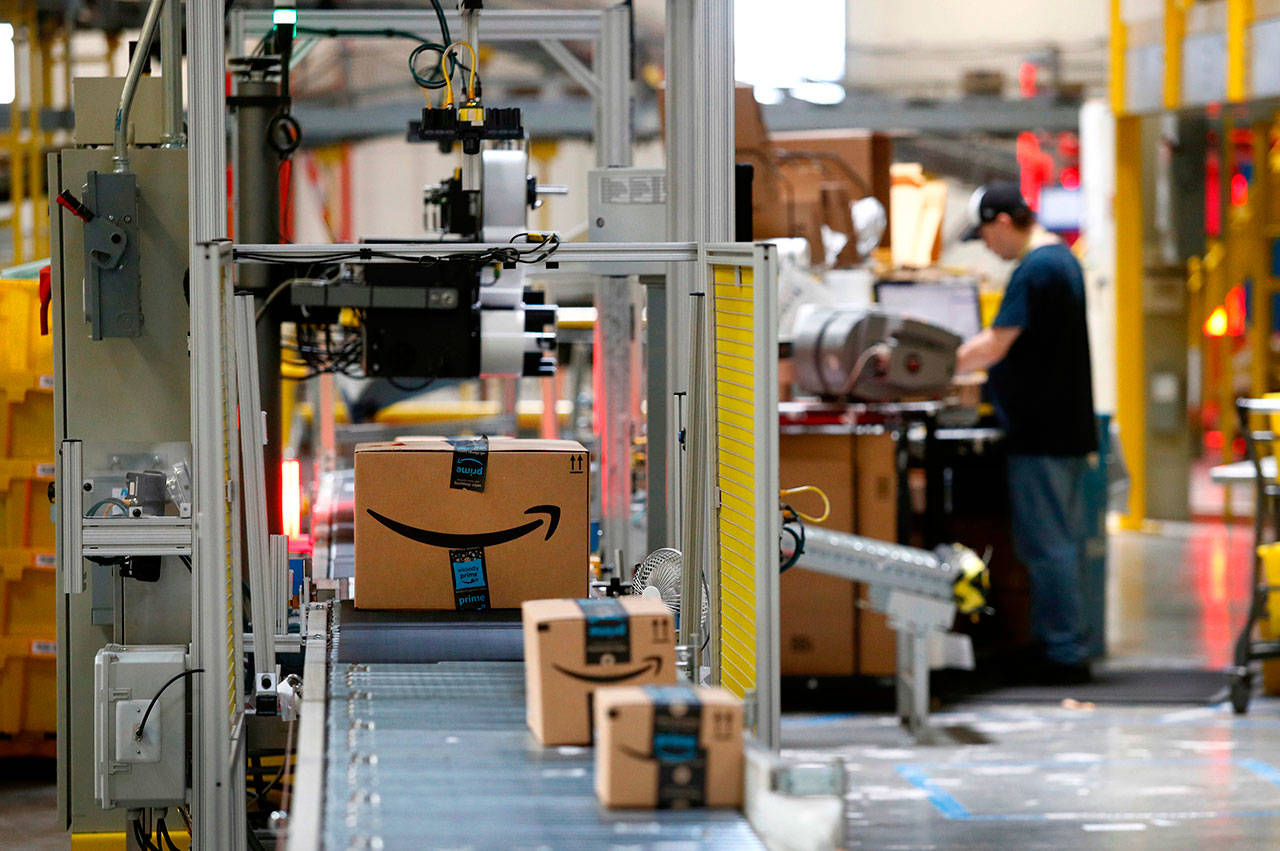 In this Aug. 3, 2017, file photo packages pass through a scanner at an Amazon fulfillment center in Baltimore. (The Associated Press)