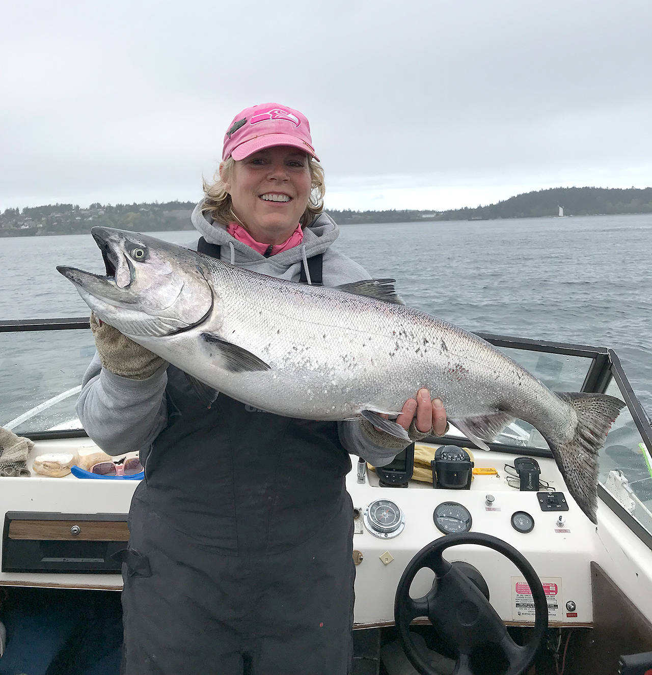 Brenda Burke and Kevin Meehan caught this 19.6-pound chinook while fishing Midchannel Bank off Port Townsend using a Silver Horde cop car lure in 130 feet of water Sunday, the last day of the blackmouth season. Burke said the fish checker at the Boat Haven marina told her it was the biggest fish she saw all season.
