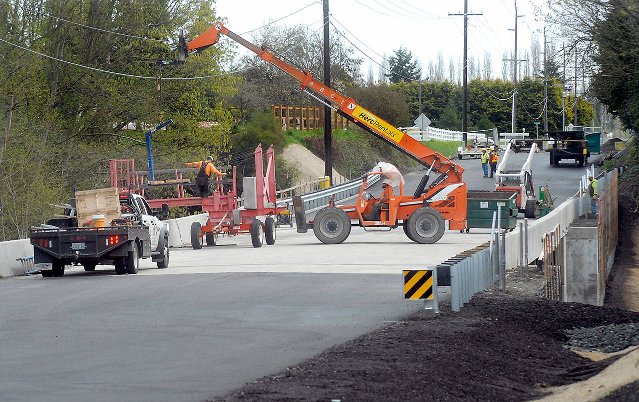 Work nears completion on the Old Olympic Highway bridge over McDonald Creek west of Sequim. (Keith Thorpe/Peninsula Daily News)