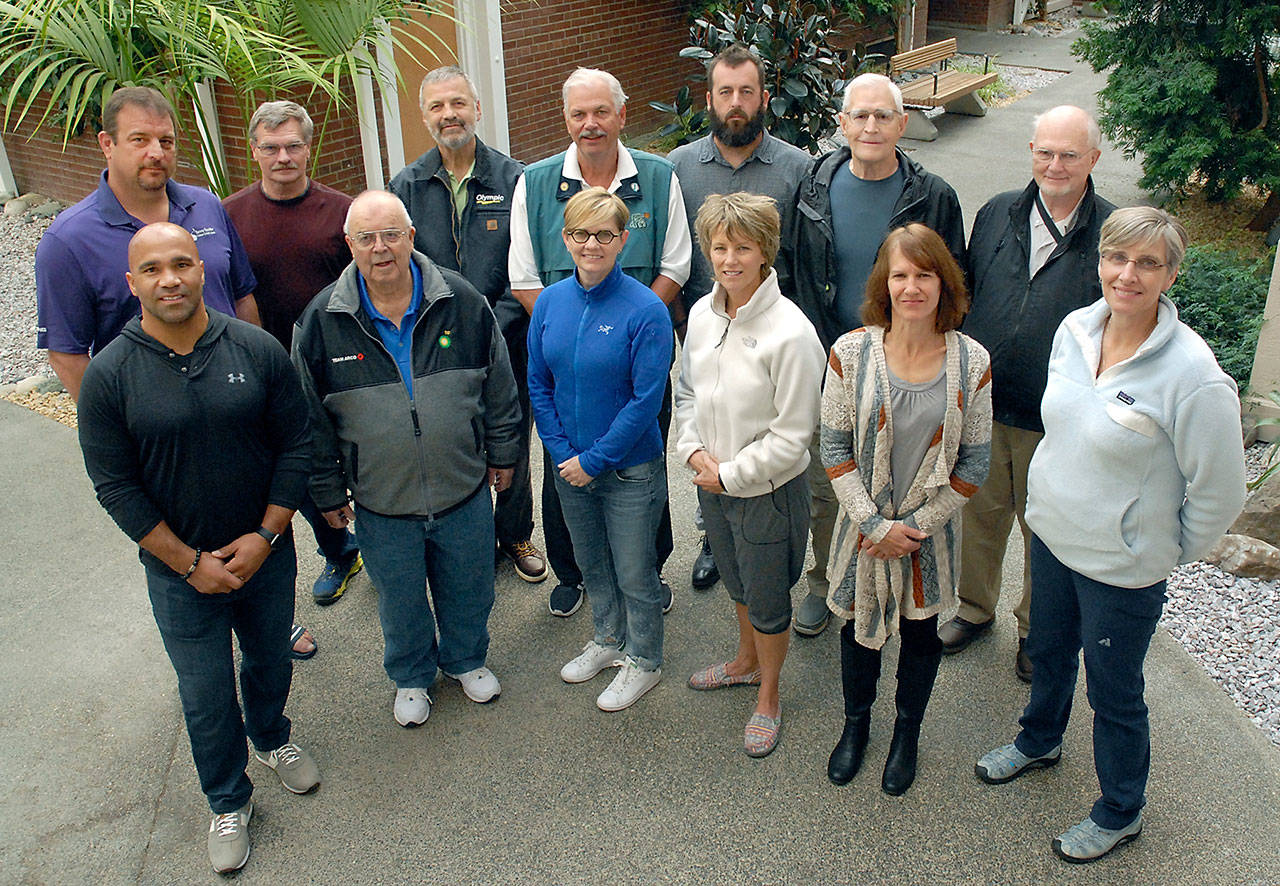 Keith Thorpe/Peninsula Daily News Inaugural inductees to the Port Angeles High School Hall of Fame included, front row from left, Joel Thomas, Scooter Chapman, Leigh Morgan, Kelli Antolock, Penny Graves and Sherri Felton, and, back row from left, Scott Jones, Art Sandison, Mike Clayton, Lee Sinnes, Jeff Ridgway, Mike Briggs and Hank Wyborney.