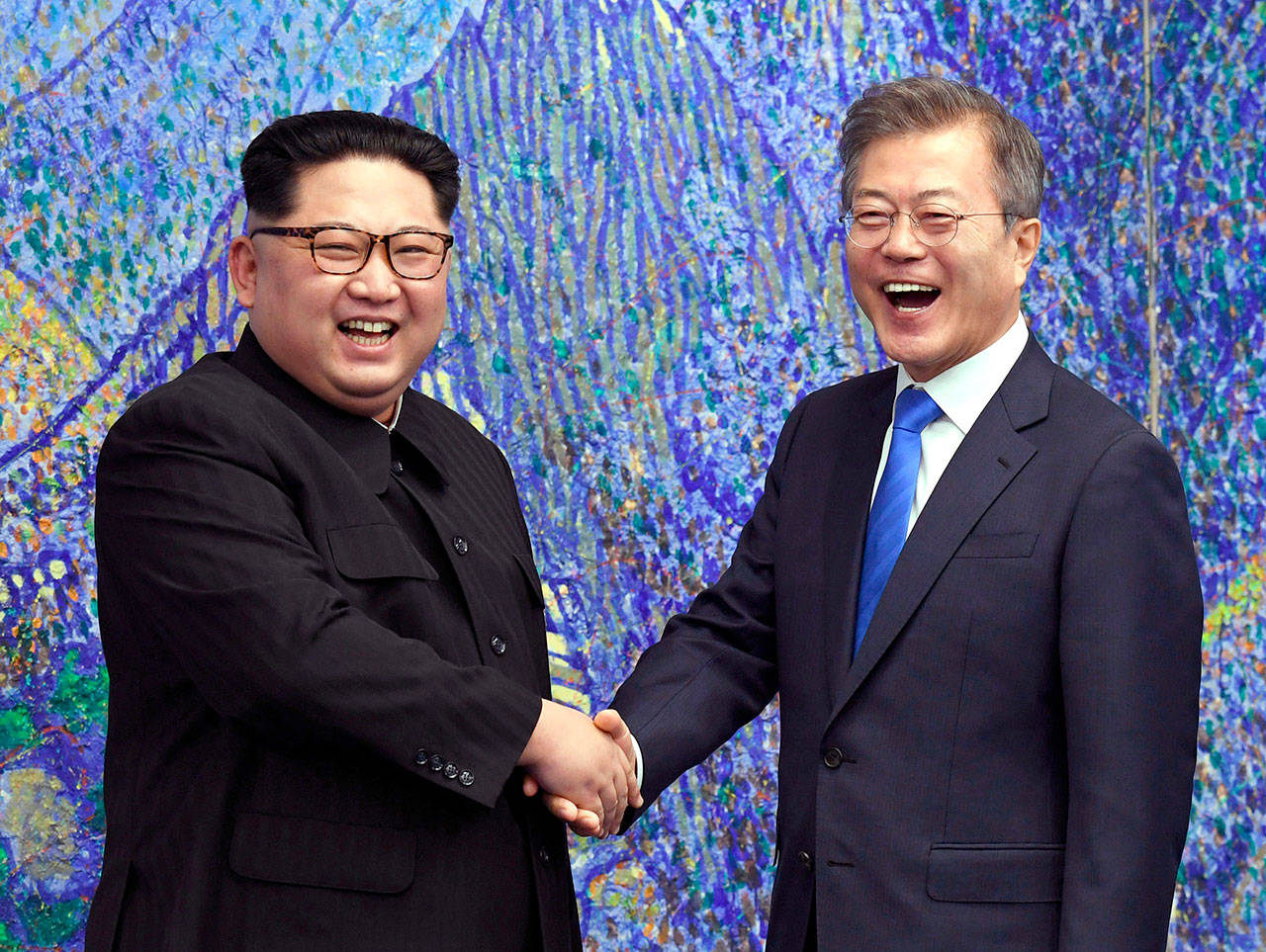 North Korean leader Kim Jong Un, left, poses with South Korean President Moon Jae-in for a photo inside the Peace House at the border village of Panmunjom in Demilitarized Zone on Friday. Their discussions were expected to focus on whether the North can be persuaded to give up its nuclear bombs. (Korea Summit Press Pool via AP)