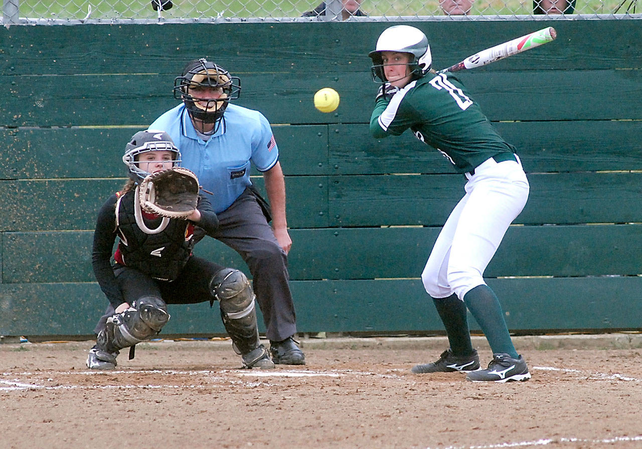 Keith Thorpe/Peninsula Daily News Port Angeles’ Erin Edwards watches the delivery to Kingston catcher Meghan Fenwick in the first inning on Wednesday at the Dry Creek athletic fields in Port Angeles. Edwards hit a three-run home run in her at-bat.