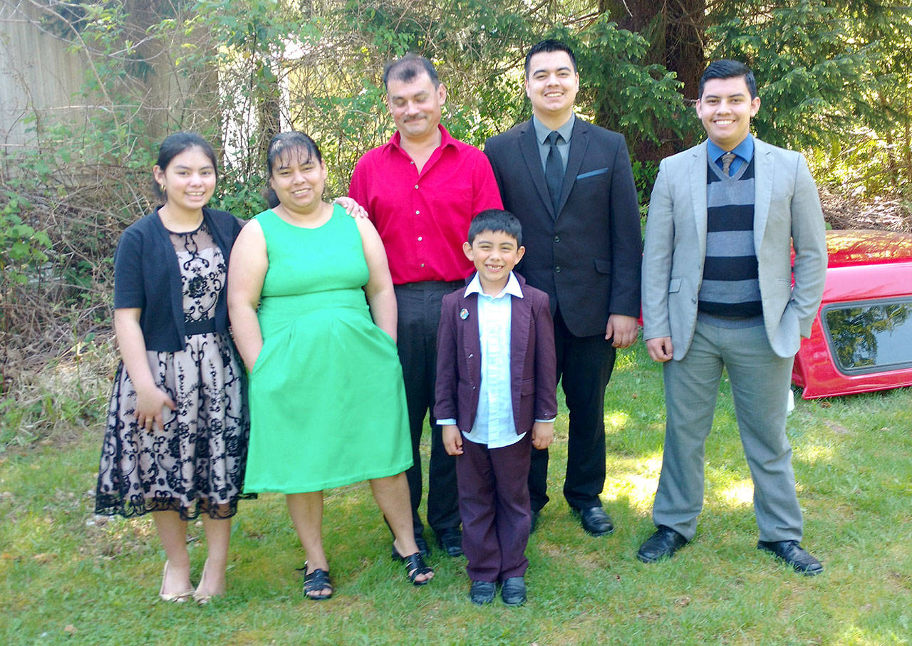 The Garcia-Perez family, from left, Diana, Maria-Elena, Salvador, Raoul and Julio. The youngest, Joel, is in front. (Zorina Barker/for Peninsula Daily News)