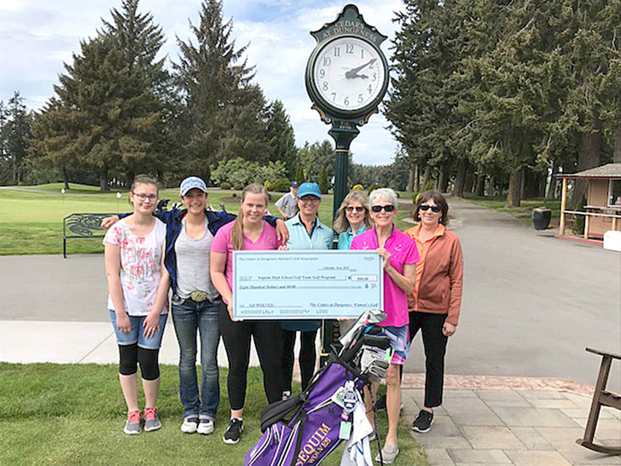 The Cedars at Dungeness Women’s Golf Club donated proceeds from its annual Whine & Roses Invitational Golf Tournament to the Sequim High School Golf program. Cathy Grant, Whine & Roses co-chair is joined by Judy Reno, co-captain, Lisa Ballantyne, captain, and Jan Clendening in presenting the check to Sarah Shea, captain of the girls golf team. Shea is joined by Sequim teammates Minzie Koch and Yana Hoesel. The Cedars at Dungeness Women’s Golf Club