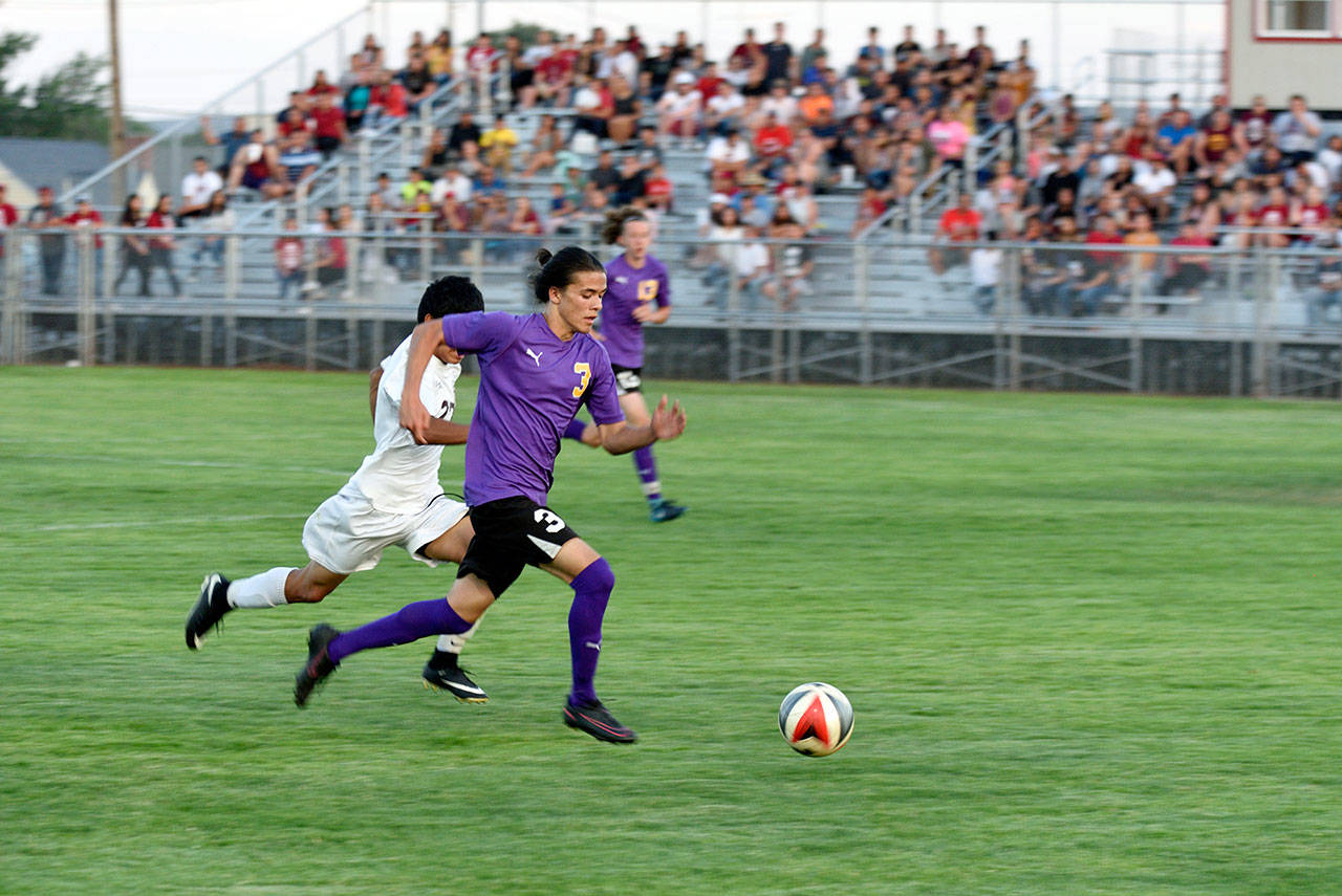 Sequim’s Ryan Tolberd races downfield with the ball during the Wolves’ state tournament defeat against Toppenish on Tuesday.                                Dave Shreffler photo
