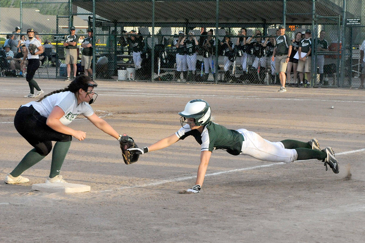 Port Angeles’ Natalie Steinman is tagged out by East Valley’s Shaelen Thompson after overrunning third on a triple. Steinman finished the state tournament going 11 for 13. (Lonnie Archibald/for Peninsula Daily News )