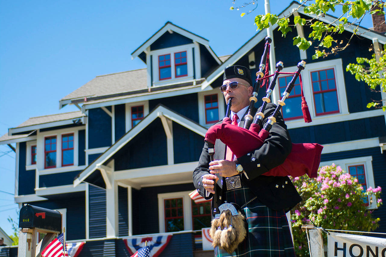 Retired Coastgaurdsman Ricky McKenzie performs at the Captain Joseph House Memorial service on Sunday. (Jesse Major/Peninsula Daily News)