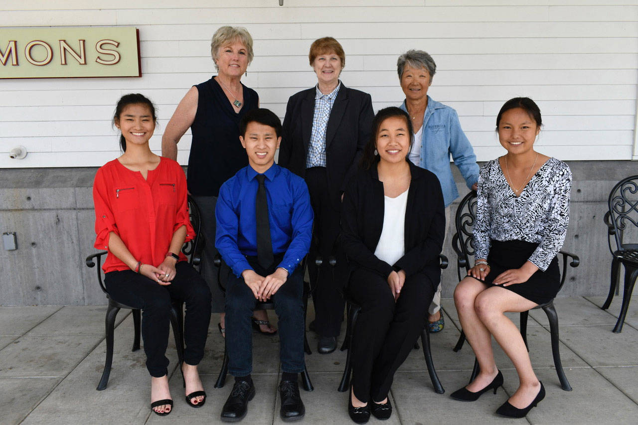 The 2018 Heart of Service Award recipients were honored at a ceremony Tuesday in Port Townsend. Recipients include, from left, Meigan Kunz, Valerie Phimister, Jason Kunz, Bonnie Douglass, Kailee Kunz, Barbara Berthiaume and Leianna Kunz. (Jeannie McMacken/Peninsula Daily News)