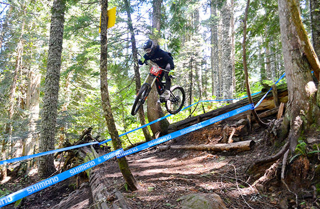 Port Angeles’ Matt Mangano rides downhill to a victory at the Northwest Cup downhill mountain biking series third race of the season at Mount Hood Skibowl last weekend.