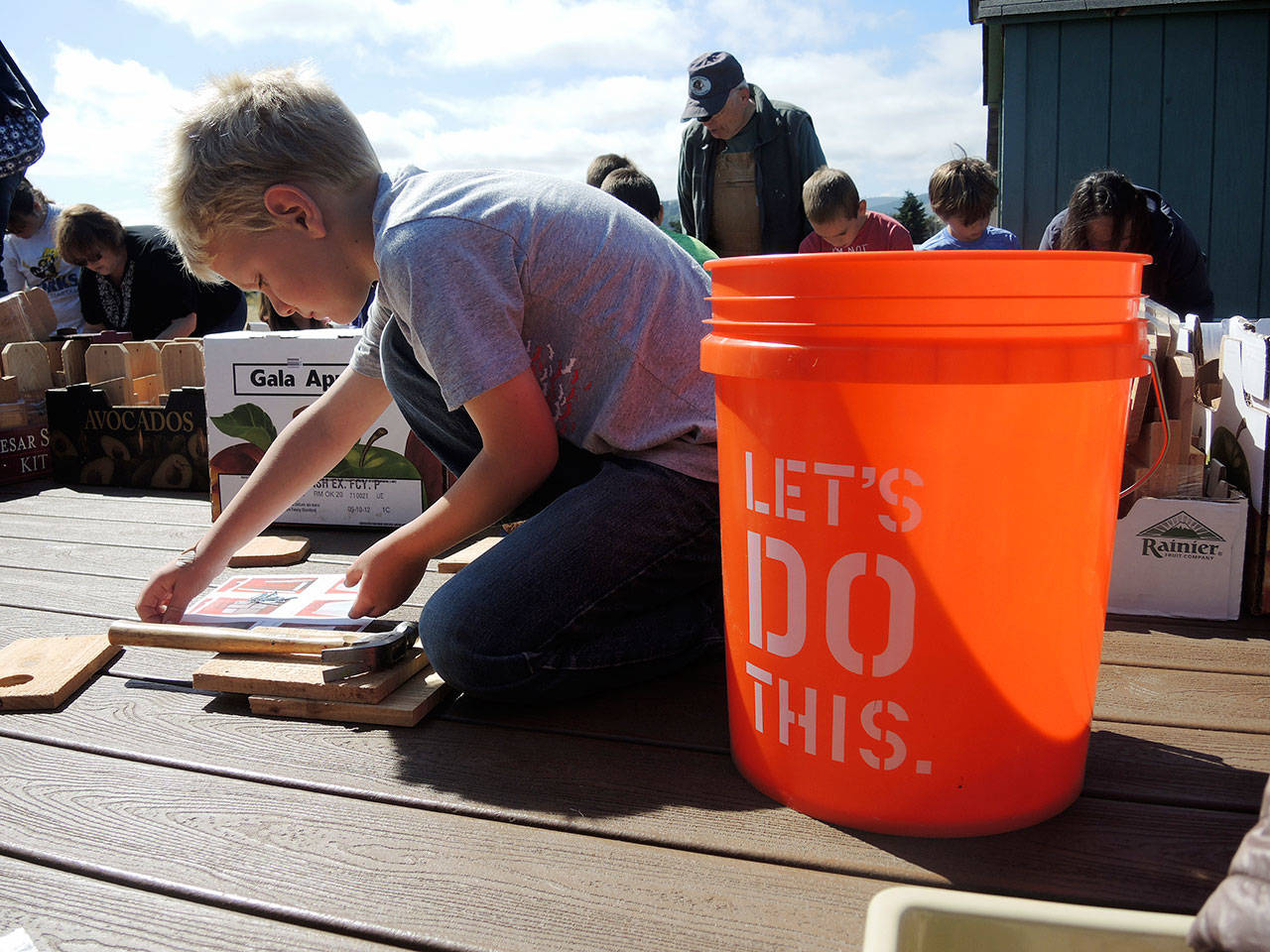 NOLS’s summer activities include building a planter box at the Forks Library.