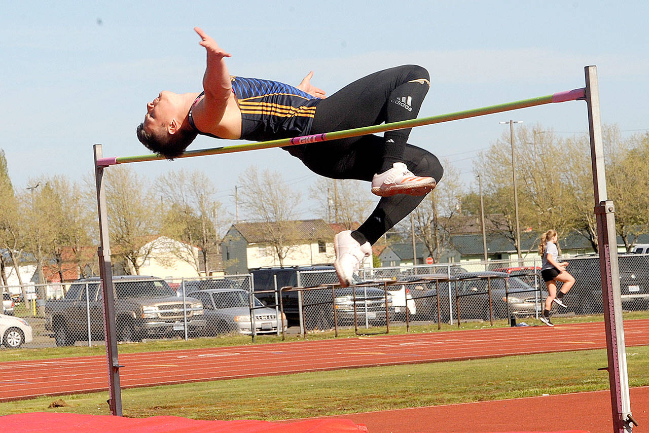 Forks’ Cole Baysinger clears 6 feet, 2 inches in the high jump at an Evergreen 1A meet in Hoquiam on May 2. Baysinger finished third in the state in the high jump and fifth in the 100-meter dash, though he took up the 100 midway through the season. He will compete in the decathlon next season for Lewis Clark State College in Lewiston, Idaho. (Lonnie Archibald/for Peninsula Daily News)