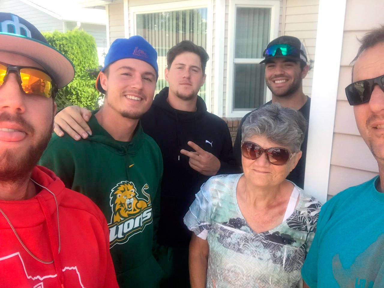 Port Angeles Lefties pose with Linda Jack after they rescued her from her burning car and drove her to her home in Kelowna, B.C.