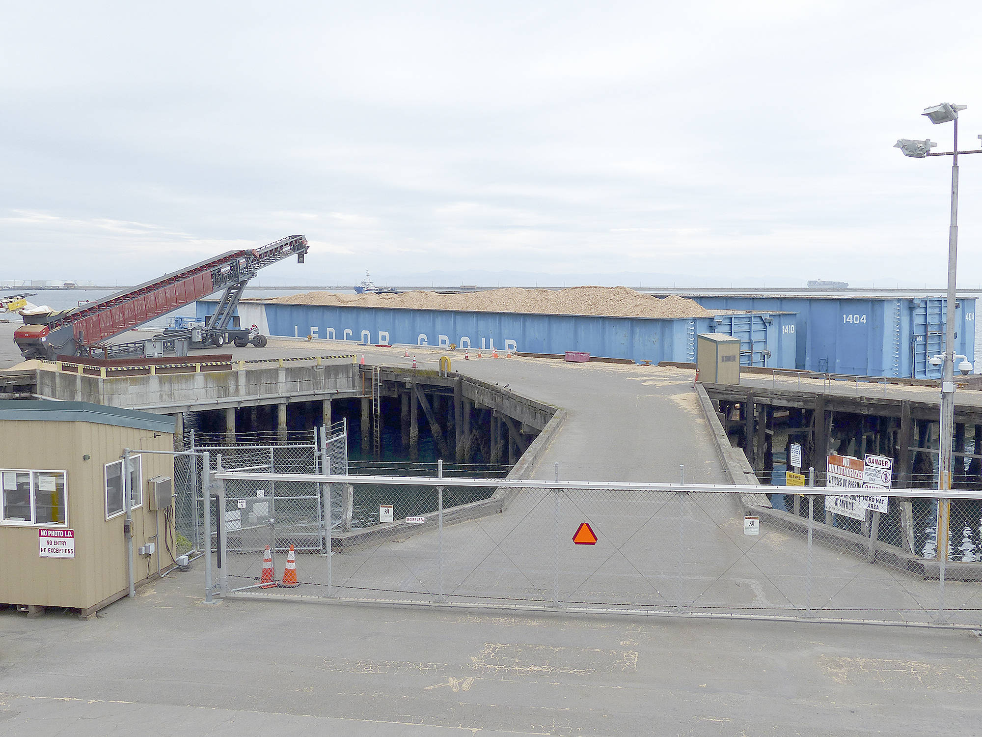 Two barges being loaded at Terminal 3 with chips for a pulp mill in British Columbia. (David Sellars/for Peninsula Daily News)