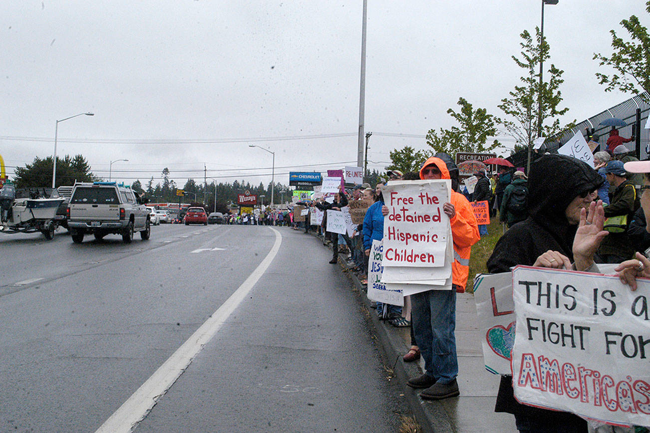 More than 675 rally against federal immigration policy in Port Angeles