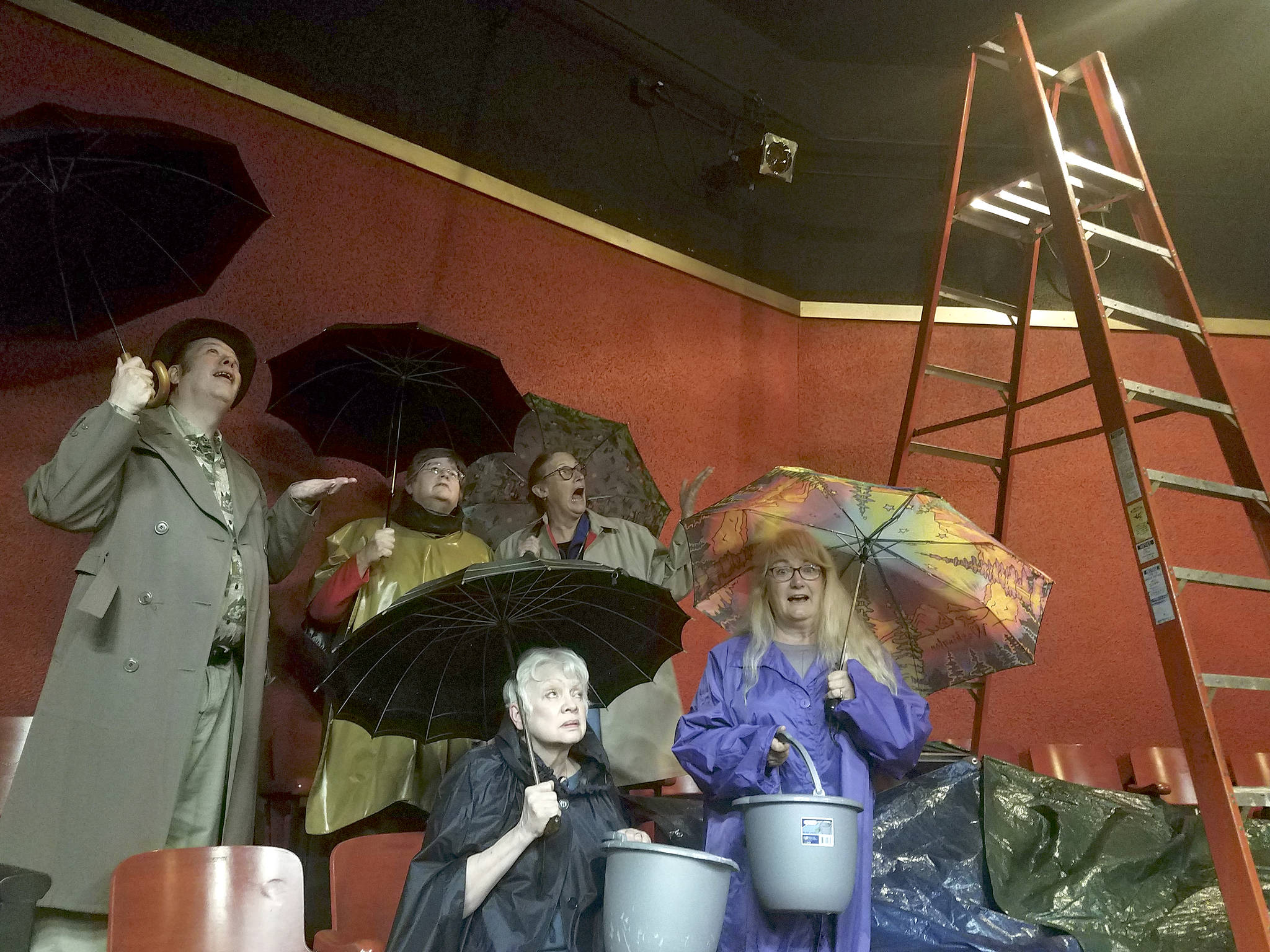 Members of the Port Angeles Community Players, from back left, Richard Stephens, Barbara Frederick, Jahanna Stewart, Janet Lucas and Kathy Balducci, discovered multiple leaks coming from the roof of the Port Angeles Community Playhouse theater in June. They anticipate the cost for repairs to come in at about $21,000.