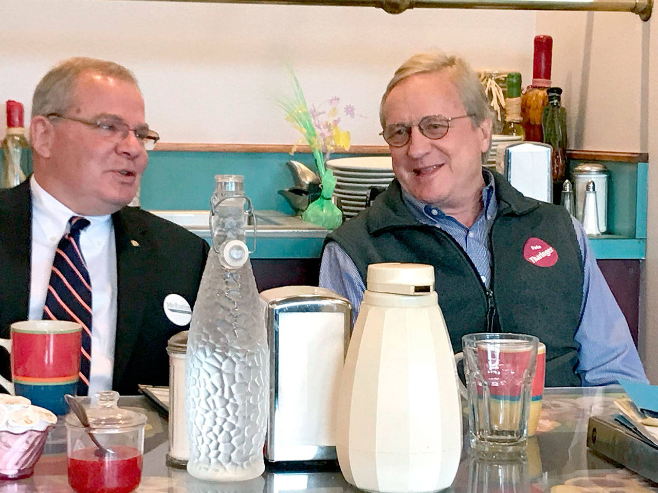 State legislative candidates Jim McEntire, left, and Steve Tharinger chat Tuesday before a candidate forum. (Paul Gottlieb/Peninsula Daily News)