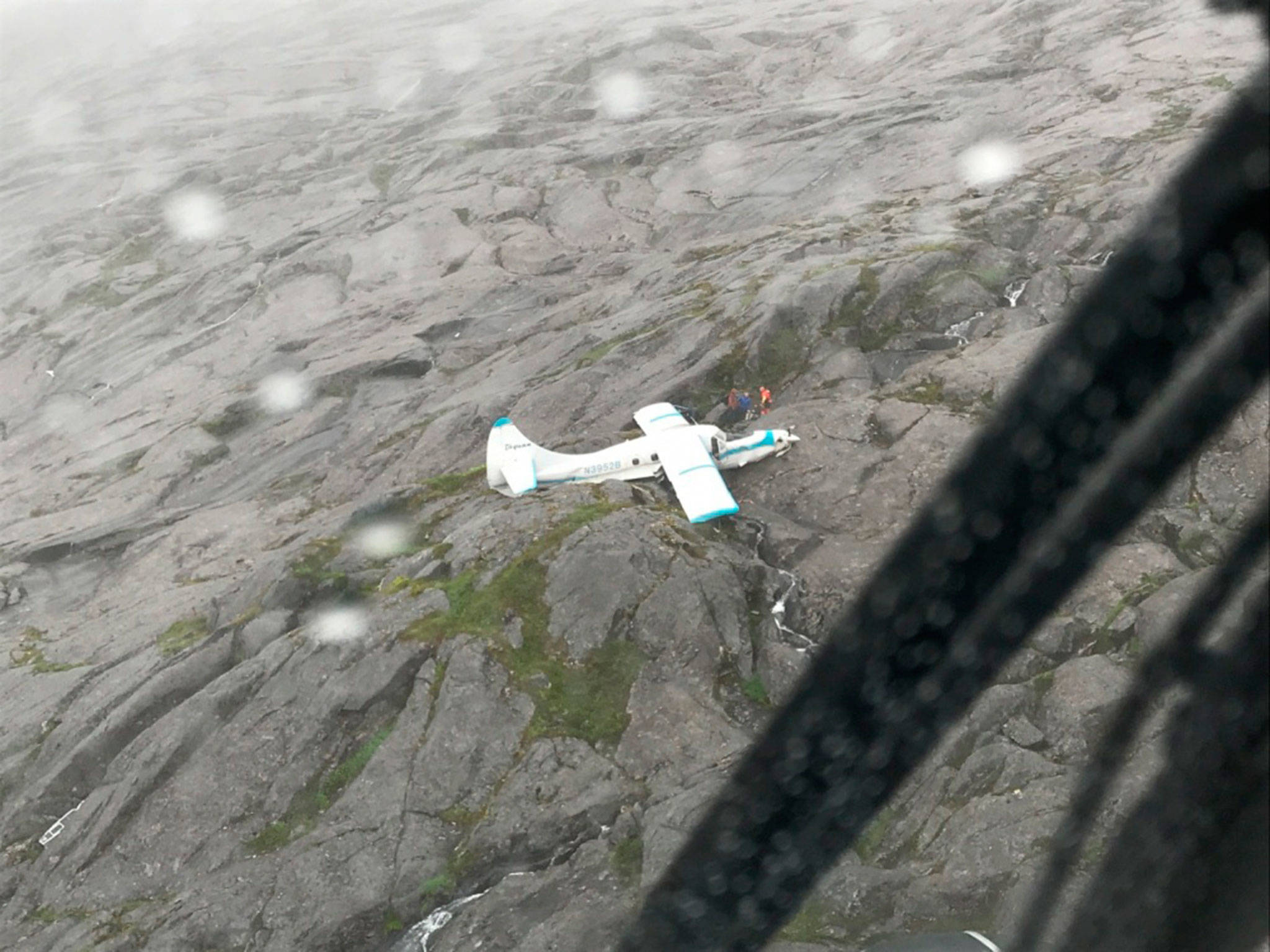 Eleven people were rescued including a Sequim man and his brother 39 miles southwest of Ketchikan, Alaska on July 10, after their plane crashed. Two Coast Guard Air Station Sitka MH-60 Jayhawk helicopter crews took the victims to a staging area nearby for further transfer to Ketchikan. (U.S. Coast Guard)