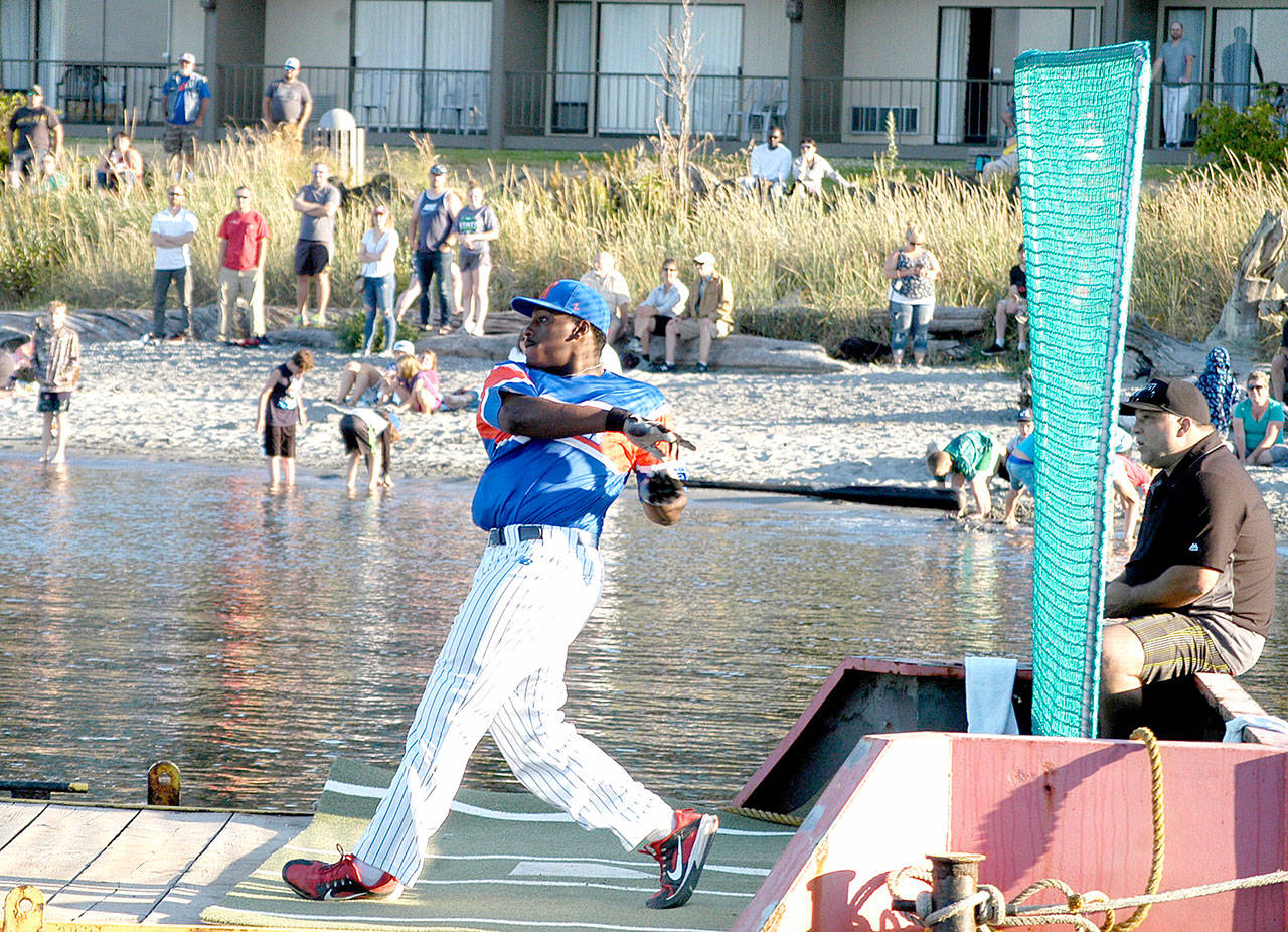 Ron Brown of the Port Angeles Lefties swings away while winning the first round of the West Coast League home run derby held off City Pier on Monday. Brown edged out Corvallis’ Cody Hawkins to take the title. (Pierre LaBossiere/Peninsula Daily News)