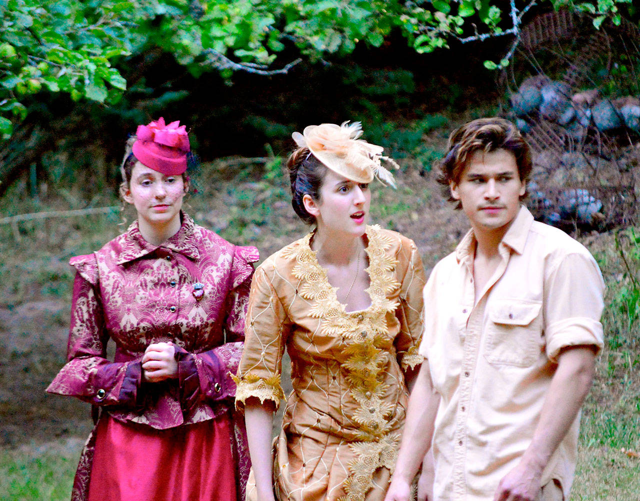 Cousins Celia (Sage Hunter), left, and Rosalind (Madelynne Jones) confront Orlando (Ryan Chen) in “As You Like It,” the romantic comedy in the meadow beside the Port Angeles Fine Arts Center. Admission is free to the play Fridays, Saturdays and Sundays through Aug. 5. (Diane Urbani de la Paz/for Peninsula Daily News)