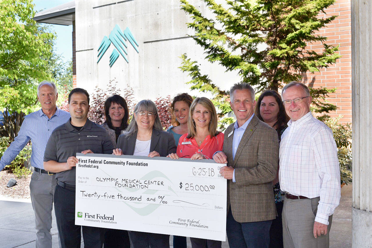 From left, Bill Littlejohn, Cancer Center Expansion chair; Anthony Aceto, branch manager, First Federal Sequim Village Branch; Christy Rookard, Western Regional manager, First Federal;Karen McCormick, executive director, First Federal Community Foundation; Mikel Townsley, patient navigator; Dawnya Scarano, Director of Retail Banking, First Federal; Jeff Davis, chiefoperations officer, First Federal; Jennifer Benson; and Bruce Skinner, executive director, Olympic Medical Center Foundation. (First Federal Bank)