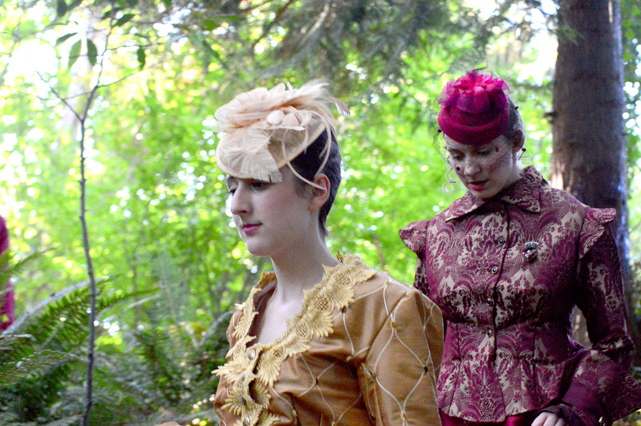 Rosalind (Madelynne Jones), foreground, and her cousin Celia (Sage Hunter) venture into Webster’s Woods for the romantic comedy “As You Like It,” playing through Sunday at the Port Angeles Fine Arts Center. (Diane Urbani de la Paz/for Peninsula Daily News)