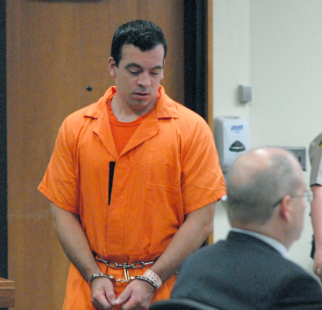 Nathan A. Chavez of Sequim enters Clallam County Superior Court to sit with attorney Stanley Myers, right, during Chavez’ sentencing on Thursday after being found guilty of guilty raping two 14-year-old girls he had befriended and with tampering with a witness in his case. (Keith Thorpe/Peninsula Daily News)